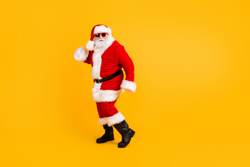 Full length body size view of his he nice funny cheerful cheery fat white-haired Santa St Nicholas dancing having fun Eve Noel tradition isolated bright vivid shine vibrant yellow color background