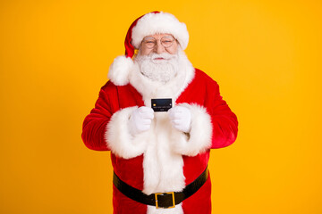 Photo of jolly holly fairy santa claus hold credit card recommend bank earnings money savings for...