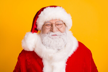 Portrait of positive advent fairy santa claus enjoy x-mas newyear celebration wear red costume isolated over bright shine yellow color background