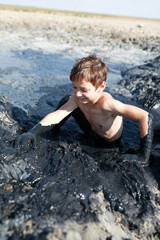 Child gets out of mud pool