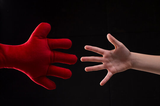 Hand Reaching Out For Help, Young Boy Playing With Plush Soft Toy, Handshake With Imaginary Friend