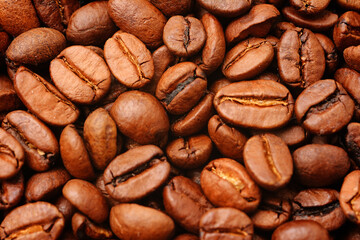 Roasted coffee beans with a close-up texture. Background textured image
