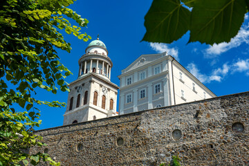Pannonhalma arch abbey detail with trees around it
