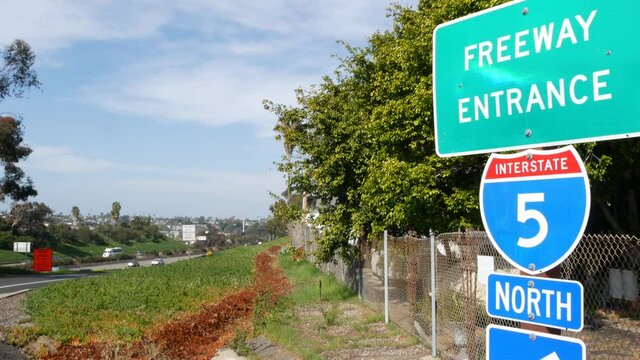 Freeway entrance, information sign on crossraod in USA. Route to Los Angeles, California. Interstate highway 5 signpost as symbol of road trip, transportation and traffic safety rules and regulations.