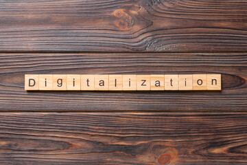 digitalization word written on wood block. digitalization text on cement table for your desing, concept
