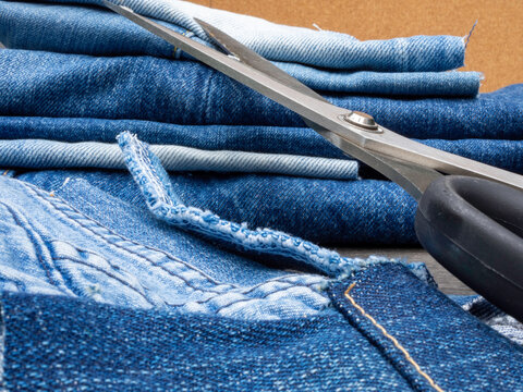 Old blue jeans ready for recycling in the circular economy. 