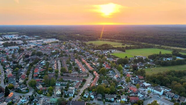 Aerial of sun setting over beautiful town in rural area