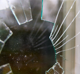 Broken natural window with broken glass background close up