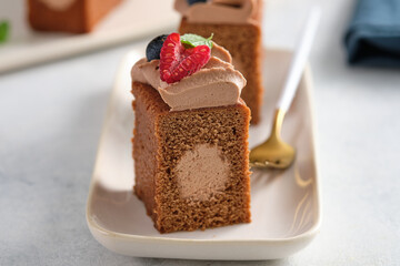 Chocolate cake with chocolate cream decoration and berries. Gourmet cake.