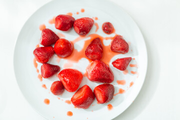 Defrosted strawberries on a plate