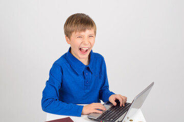 the little hacker: a Young smart boy with a netbook mentally hap