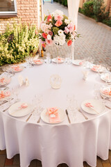 Tables for guests decorated at the banquet