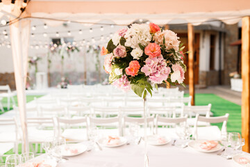 Tables for guests decorated at the banquet