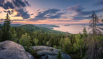 Scenic panorama landscape with lake and sunset at evening in Koli, national park, Finland - 375591986