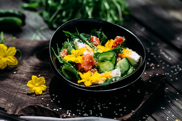 Salad with salmon, arugula, cucumber and egg
