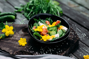 Salad with salmon, arugula, cucumber and egg