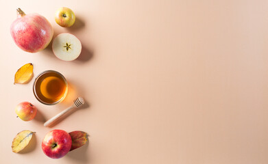 Rosh hashanah (Jewish New Year holiday), Concept of traditional or religion symbols on pastel orange paper background.