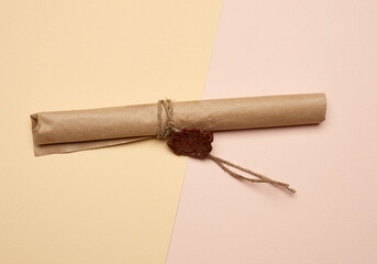 brown paper roll sealed with wax seal, top view