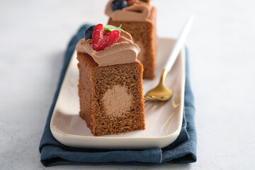 Chocolate cake with chocolate cream decoration and berries. Gourmet cake.