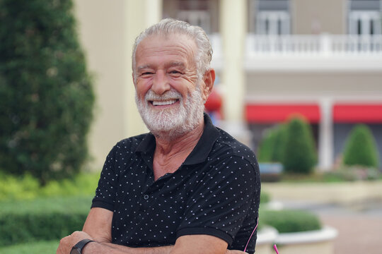 Caucasian Senior man with beard mustache smile and standing looking at camera