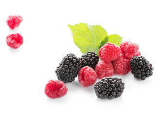 Raspberries and blackberrie isolated on white background