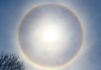 Beautiful sun halo phenomenon with circular rainbow, solar halo the ring is caused by sunlight...