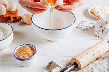 Ingredients for baking and Breakfast with eggs, flour, sugar, milk and butter on a white wooden background. Delicious and healthy food.