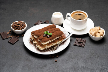 Classic tiramisu dessert, cup of coffee, sugar and milk on concrete background