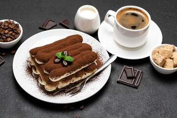 Classic tiramisu dessert, cup of coffee, sugar and milk on concrete background