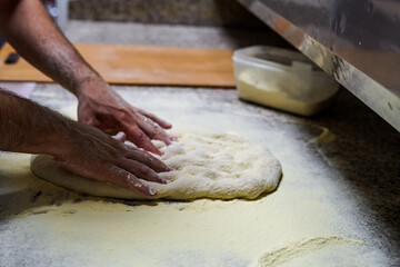 preparation of pizza in pala