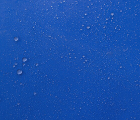 Water drops on a blue background. Clean water