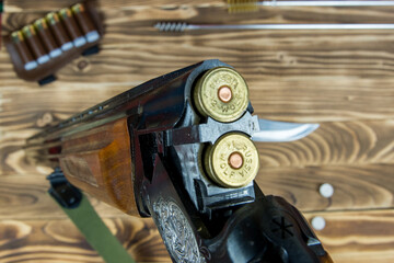 cartridge in the chamber of a hunting double-barreled rifle