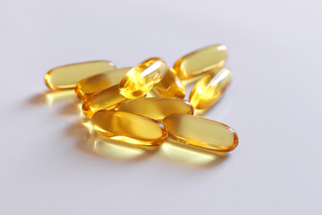 Omega 3 fish oil capsules isolated. 
A bunch of Omega 3 capsules on a white background.