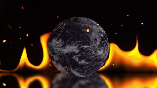 Global warming concept with a buring Earth with sparks and flames