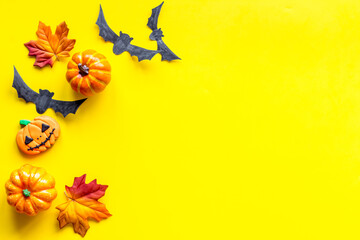 Halloween holiday banner design - pumpkins, cookies and autumn leaves, top view