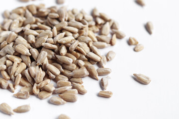 A bunch of sunflower seeds, isolated on white background. View from above.