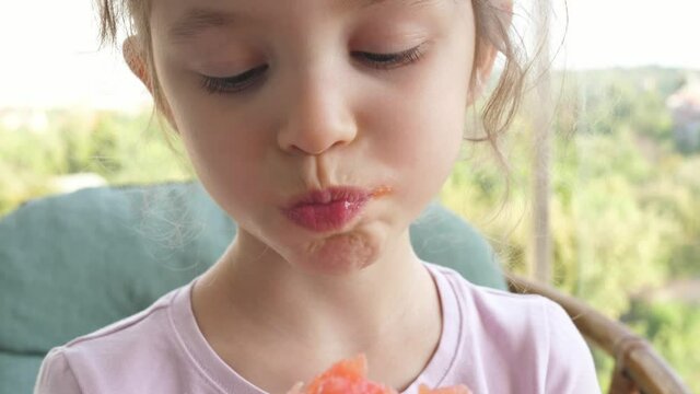 cute little girl child eat eating fresh refreshing juicy watermelon summer 