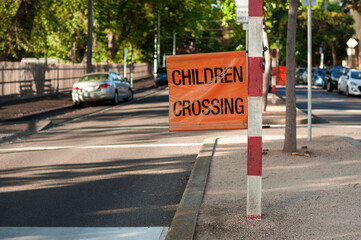 Road sign near the school. Children crossing. Melbourne, Australia. 