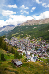 Fototapeta premium View of Zermatt village, Switzerland, from above, with mountains during summer