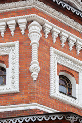 Church red brick wall with white decoration