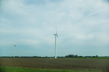 Fototapeta premium wind turbine on a green field