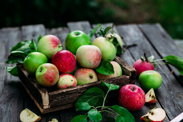 Ripe apples in a wooden box