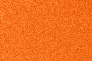 Orange color concrete wall texture for background and design.