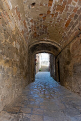 Fototapeta na wymiar A Medieval Street in Volterra, Italy