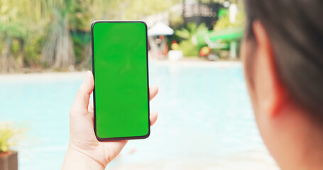 woman with green screen smartphone