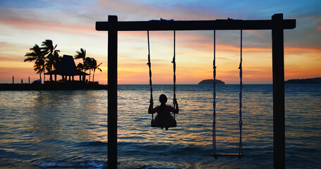 asian girl play the swing