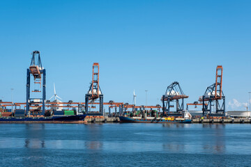 Fototapeta premium Coal terminal wih big industrial cranes for handling coal transportation on the Maasvlakte in the port of Rotterdam