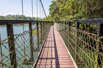 Obraz premium pond with suspension bridge at Toushe Reservoi