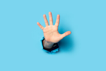 Men's palm on a blue background. Banner. Five fingers gesture