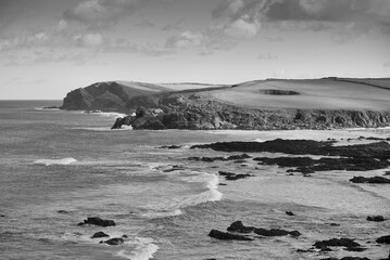 Monochrome image of beach and cliffs of the coast of North Cornwall